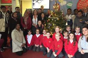 Pupils and Gill Ellis, headteacher of Coed Eva Primary School in Cwmbran, welcoming USW students to a Nativity Play on   December 2 . Neil Gibson