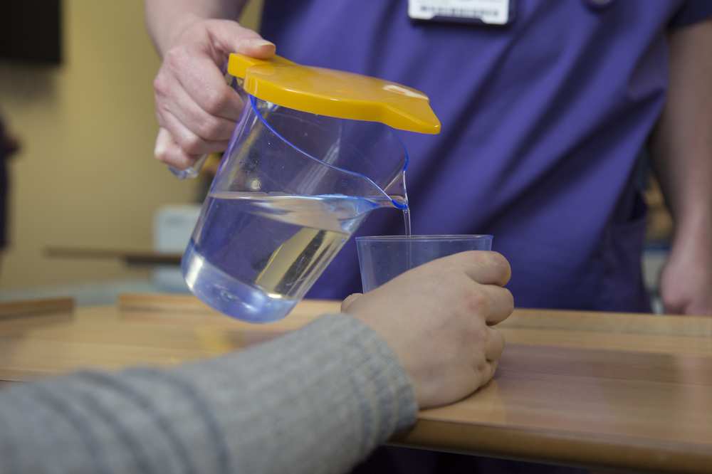 Team hydr8, yellow jug lids, adult nursing students